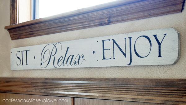 Sign made from an old fence picket from COnfessionsofaserialdiyer.com