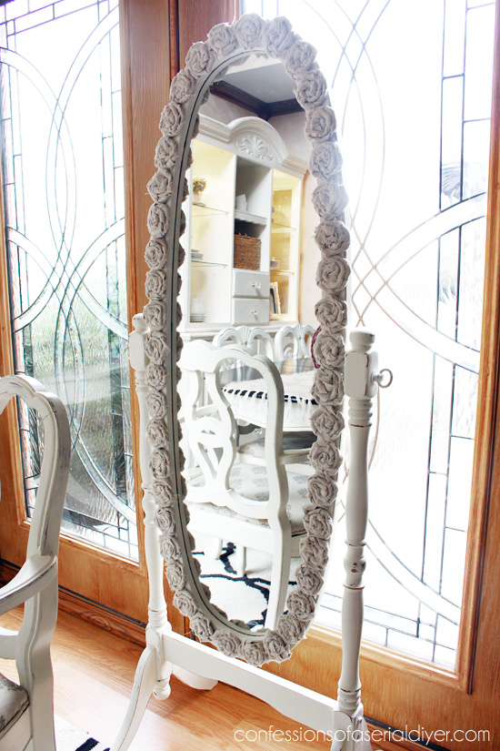 Rosette-Framed MIrror {Drop cloth is perfect for shabby rosettes!)