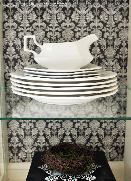 The ironstone really pops against the black damask print.