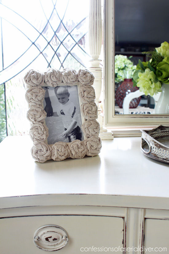 A boring frame is updated with DIY rag rosettes