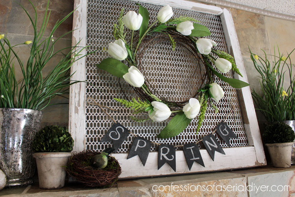 One more use for an old window...as the perfect backdrop for a wreath, by adding a metal grate.