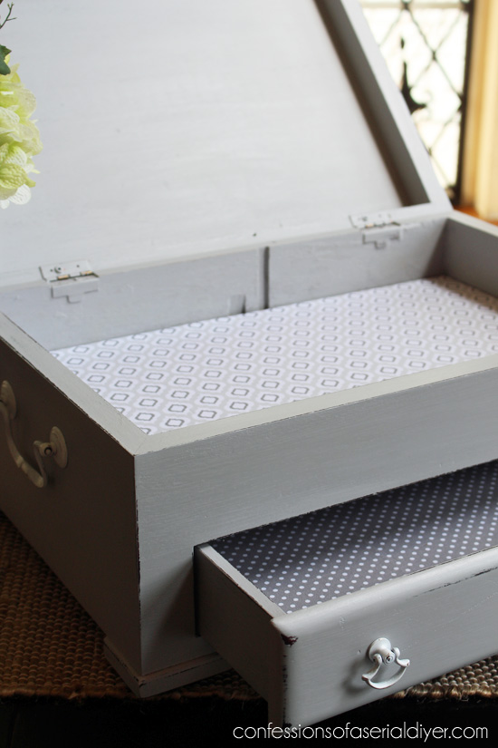 Flatware box made gorgeous with a little paint and fabric. Now it can hold more than just flatware!