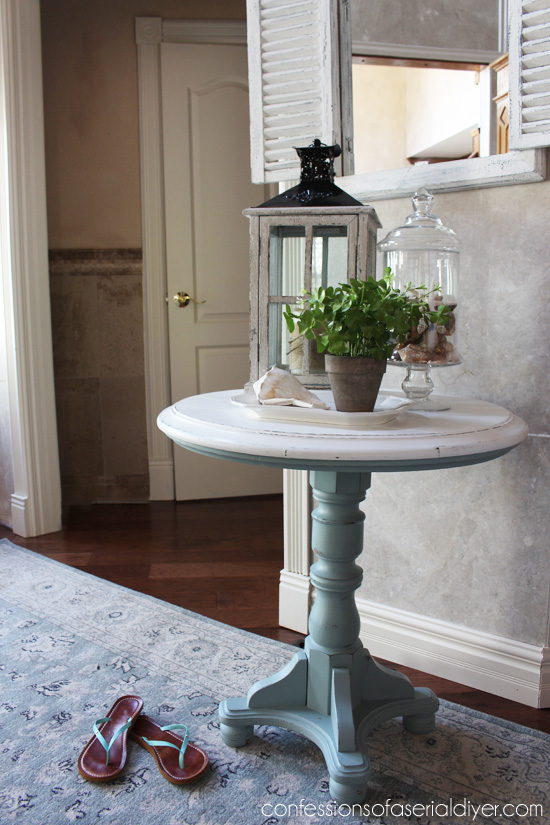 Coastal Inspired Pedestal Table using DIY chalk paint with Behr's Gray Morning and white. 