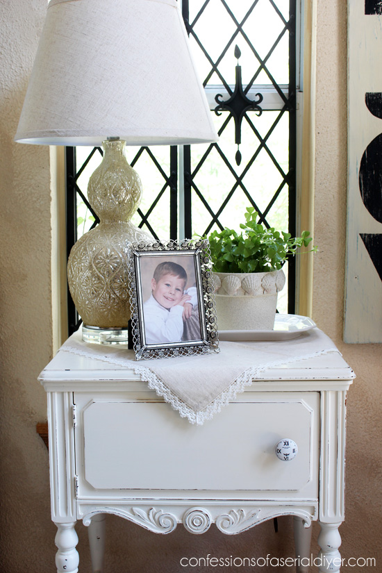 Give a terra cotta pot a beachy makeover with faux stone spray paint and scallop shells!