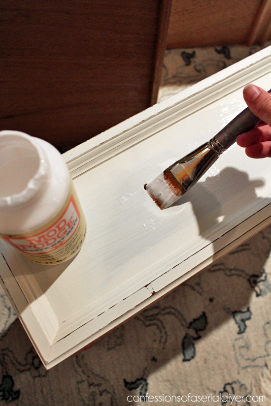 Use matte Mod Podge to attach fabric to drawer fronts for a whole new look.