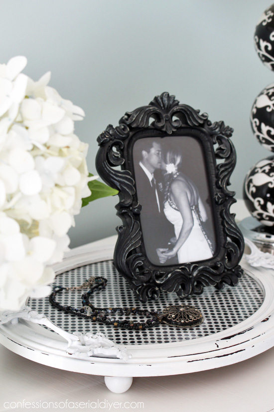 Repurpose a favorite scarf by puttingit under tha glass in a picture frame turned tray!