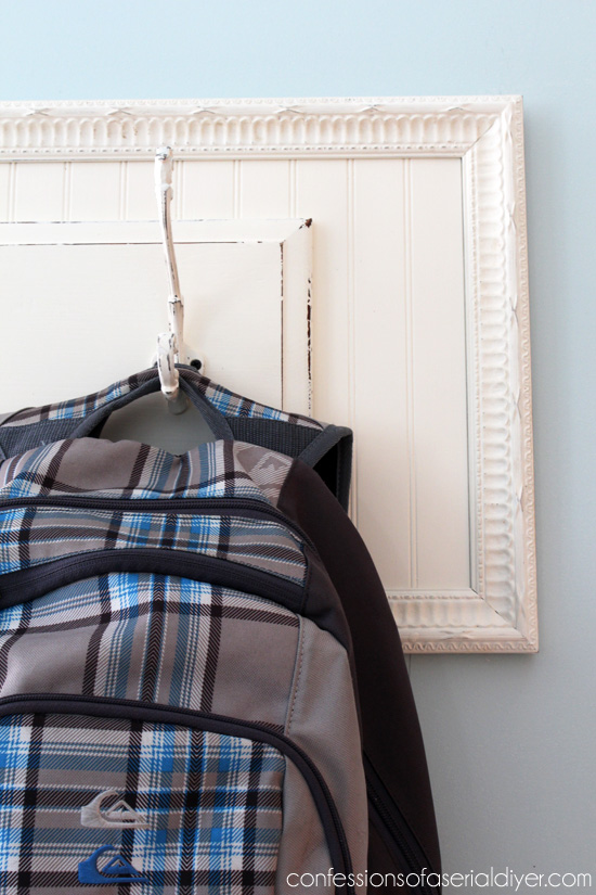 Pair an old drawer front and a thrift store frame to create a simple hanging rack!