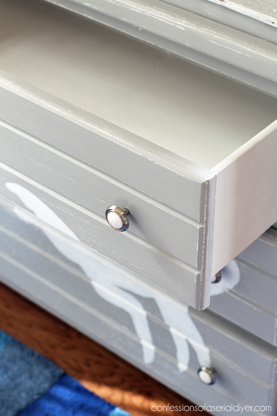 Spray paint is the best way to paint the insides of drawers. 