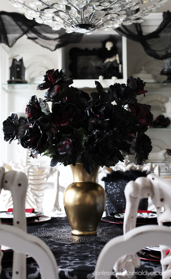 Spray paint old florals black for an easy Halloween centerpiece!