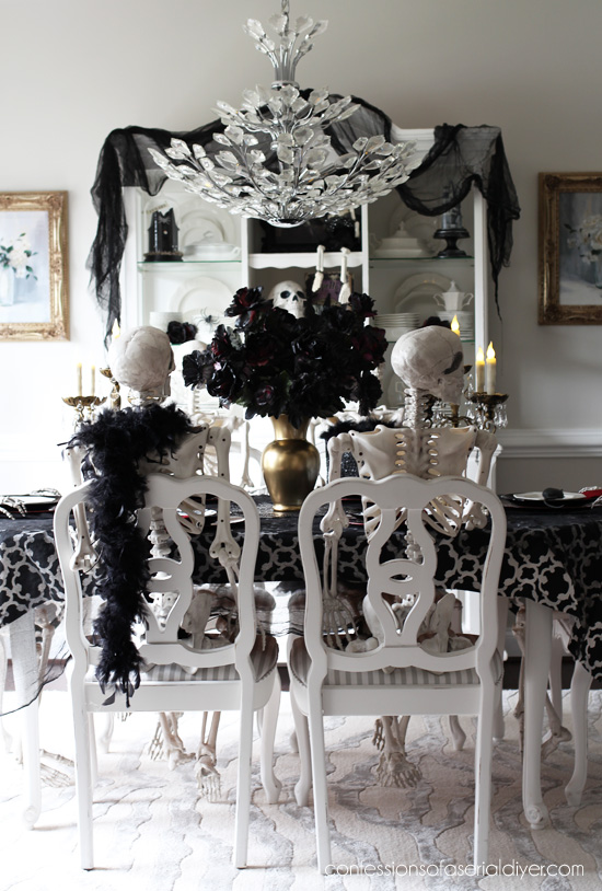 Halloween dining room skeleton party from confessionsofaserialdiyer.com
