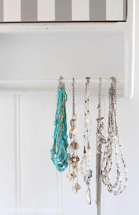 80's Towel Bar shelf repurposed into necklace storage from confessionsofaserialdiyer.com