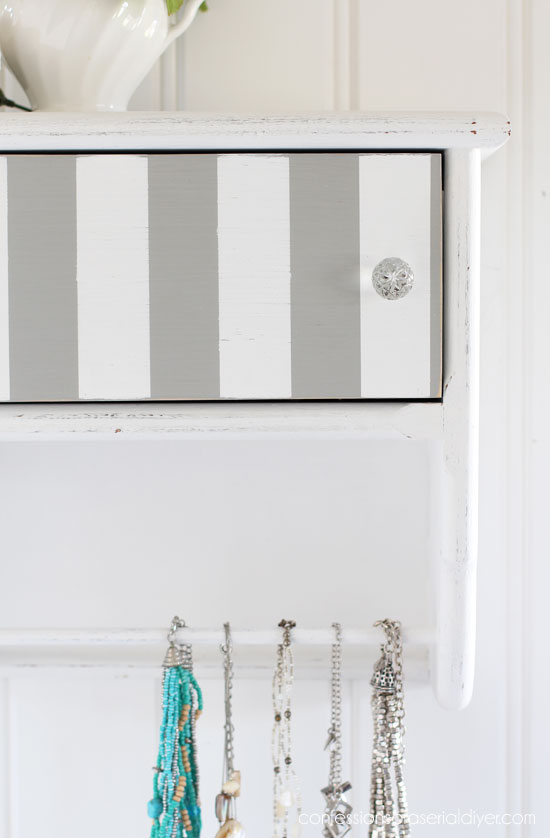 80's Towel Bar shelf repurposed into necklace storage from confessionsofaserialdiyer.com