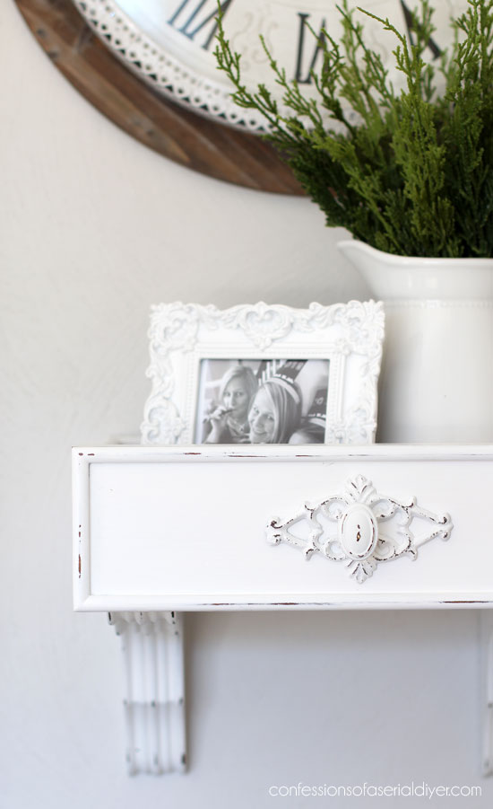 Turn and old drawer and a pair of brackets into a cute wall shelf.