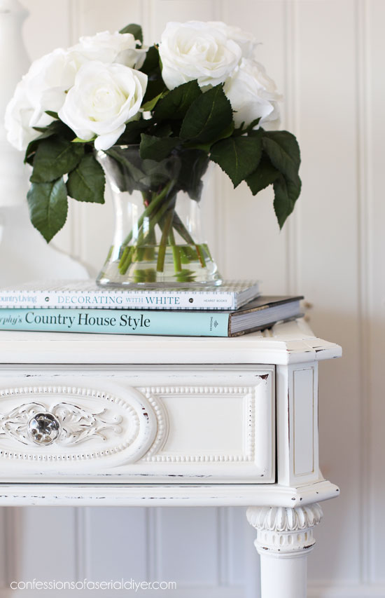 White chalk painted end table with beautiful details.
