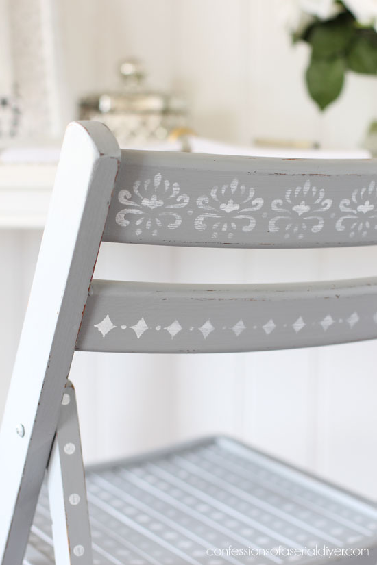 Stenciled wooden folding chair from confessionsofaserialdiyer.com