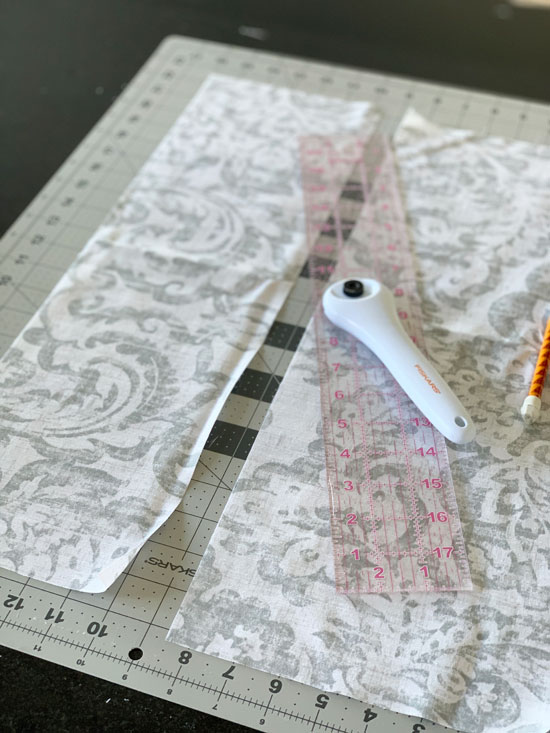 Use a rotary cutter and straight edge to cut fabric in perfectly straight pieces.