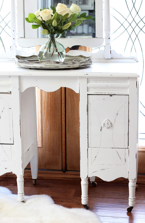 Close up of thrift store dressing table painted white and distressed