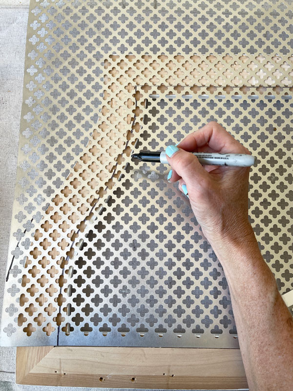 How to add decorative sheet metal to a mirror frame