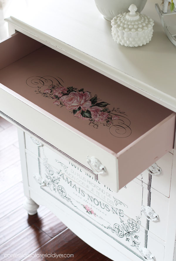 Pink drawers on white dresser