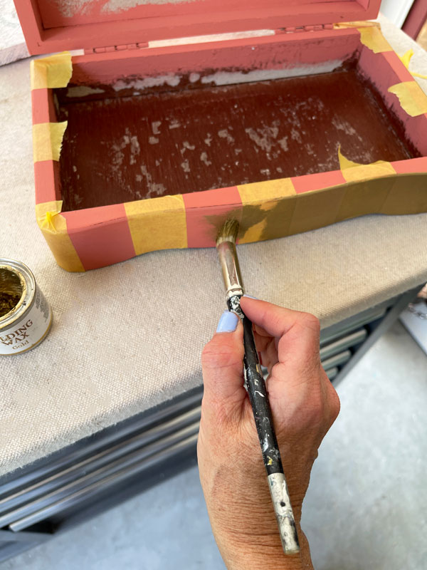 Adding gold gilding wax