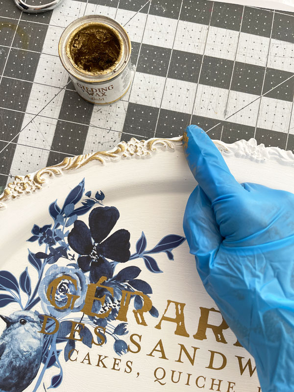 Gold gilding wax on a silver tray