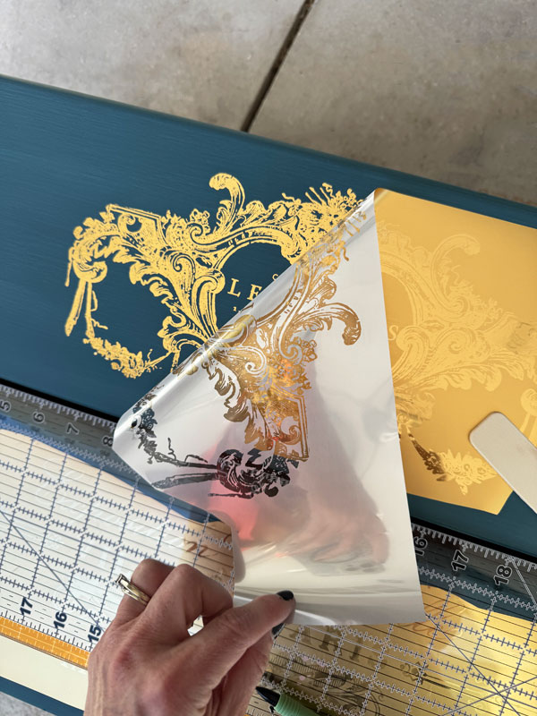Perfume Notes transfer on a blue dresser