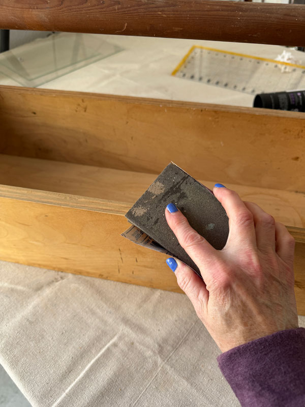 Always give raw wood a light sanding before painting for a smooth result.