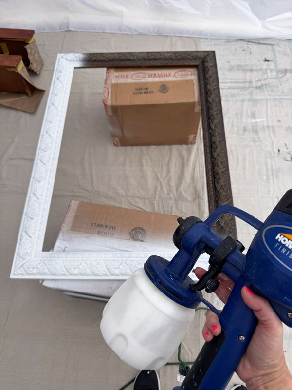 Painting a mirror with with a paint sprayer