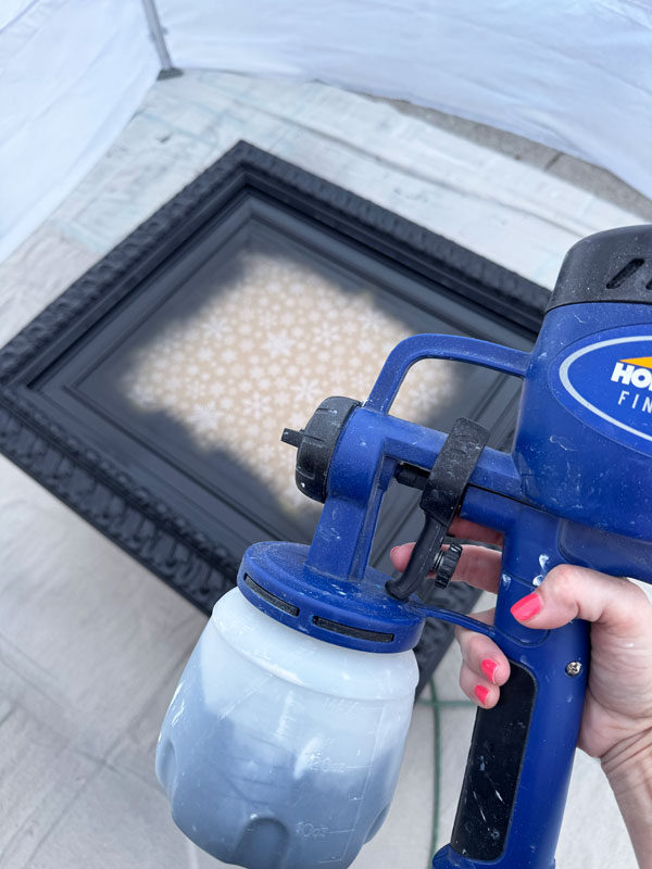 Spraying a mirror with the HomeRight FInish Max sprayer