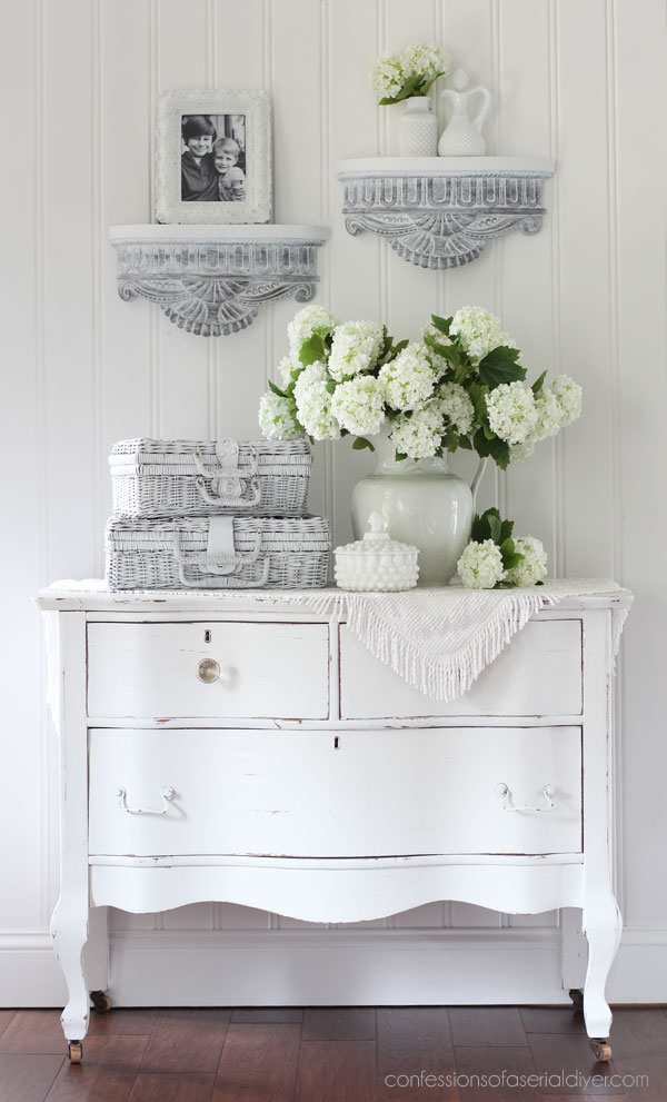 White washed carved wood shelves