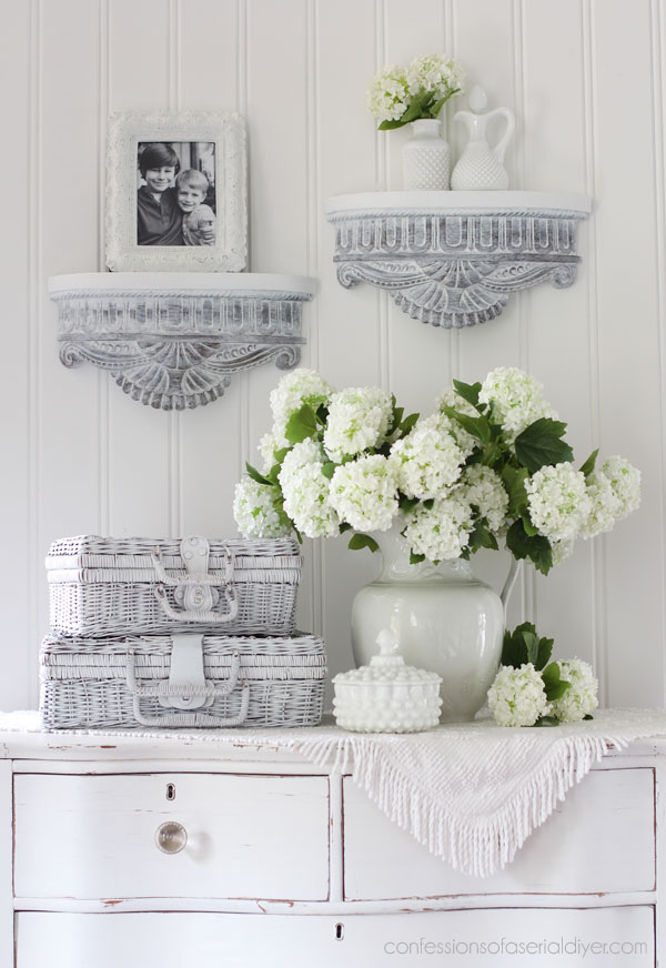 White washed carved wood shelves