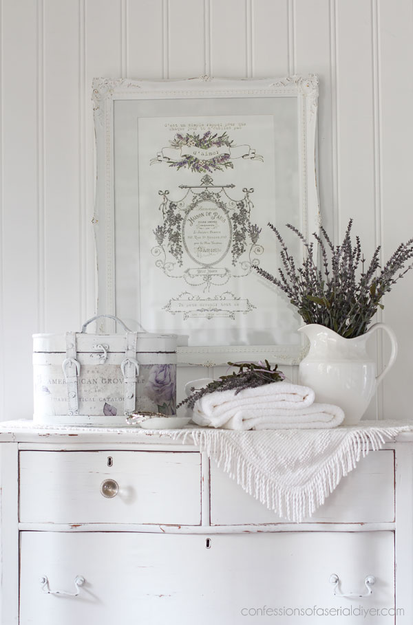 Round wooden storage box makeover with decoupage paper.