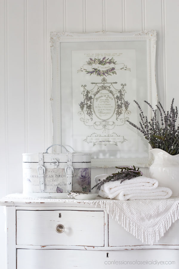 Round wooden storage box makeover with decoupage paper.