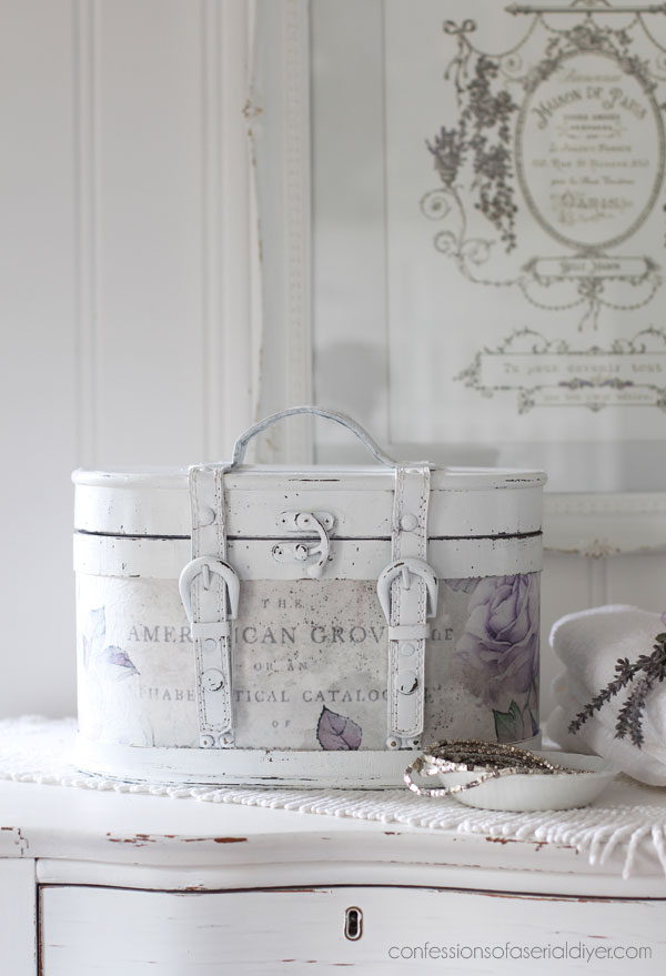 Round wooden storage box makeover with decoupage paper.