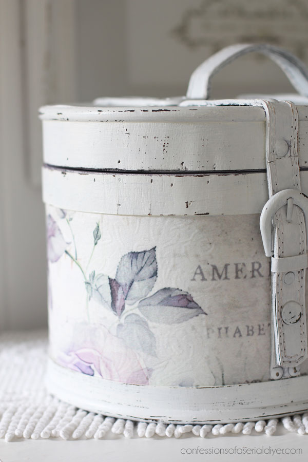Round wooden storage box makeover with decoupage paper.