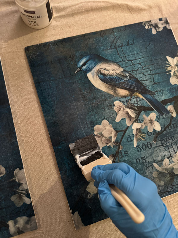 Applying decoupage paper to door panels