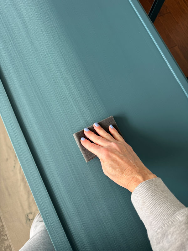 Use a foam sanding sponge to smooth out the chalk-painted surface.
