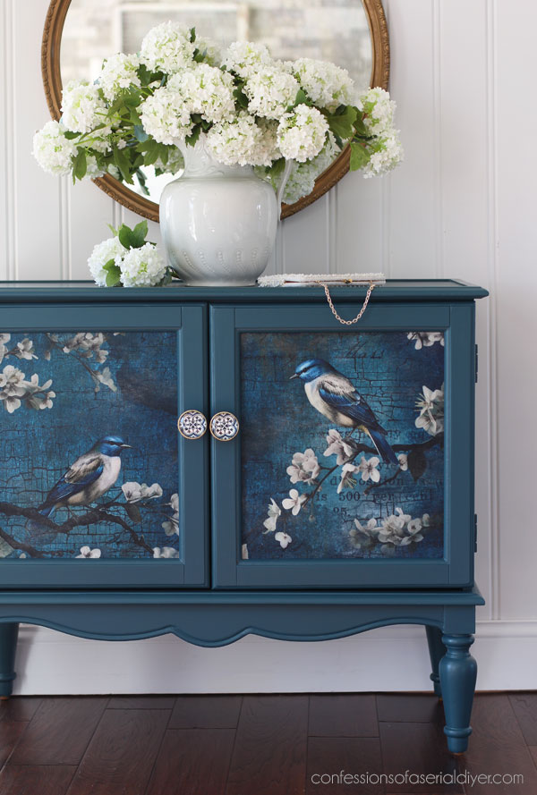 Antebellum Blue and Sapphire Wings decoupage paper on a glass door cabinet