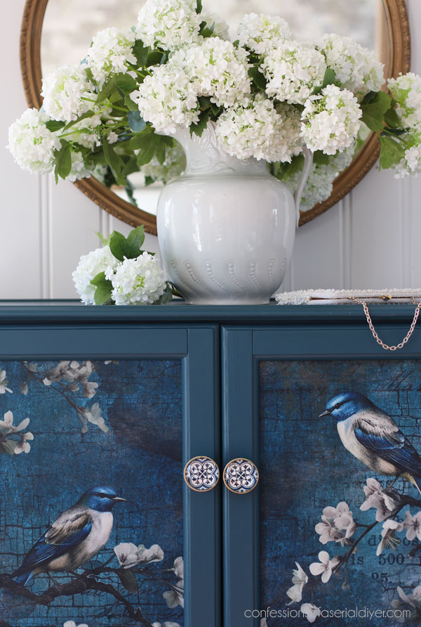 Antebellum Blue and Sapphire Wings decoupage paper on a glass door cabinet