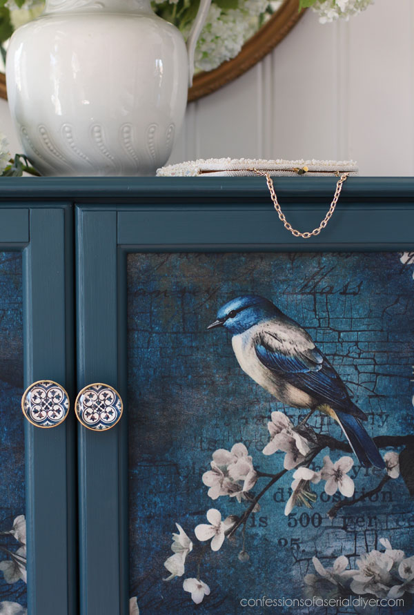 Antebellum Blue and Sapphire Wings decoupage paper on a glass door cabinet