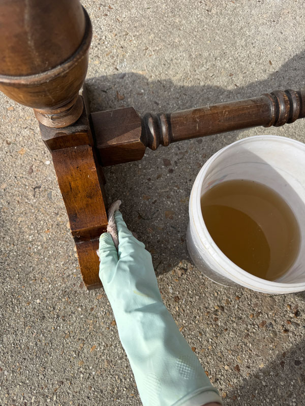 Prepping a table for paint with White Lightning cleaner.