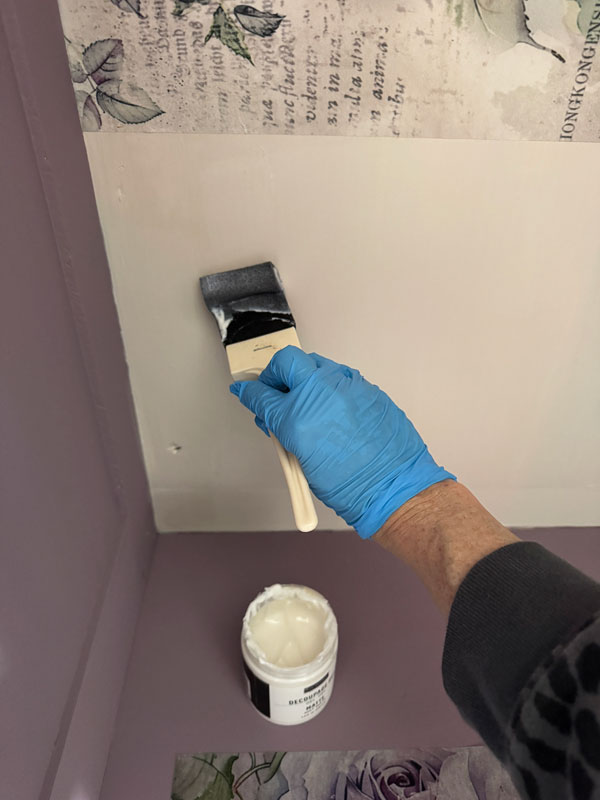 Applying decoupage paper with decoupage gel, and a foam brush