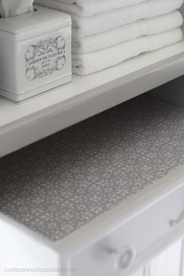 Lining the drawers with fabric.