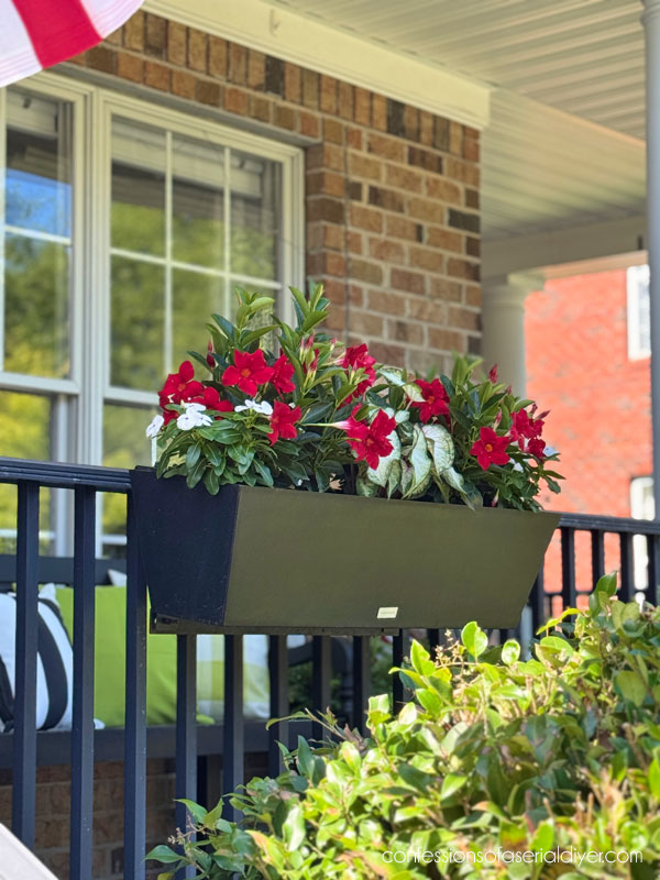 Window boxes on porch railing