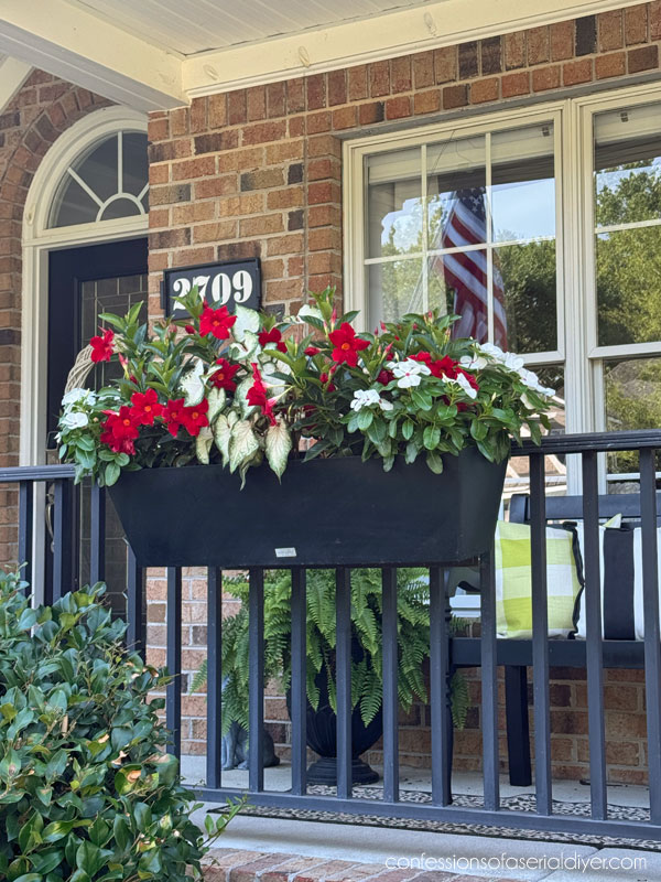 Window boxes on porch railing