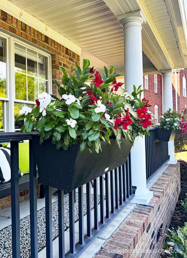 Window boxes on porch railing