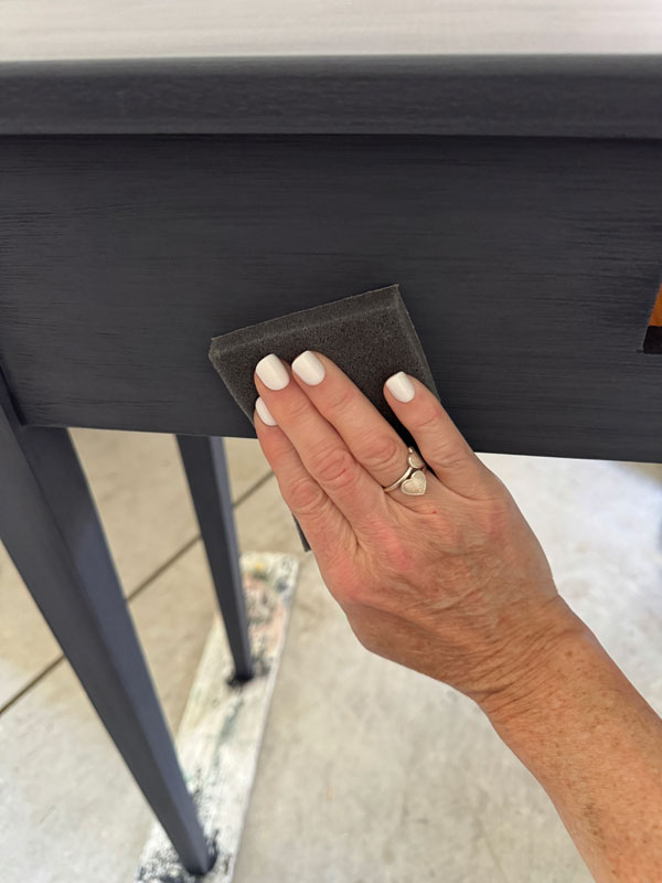 Sand with a fine grit sanding sponge if you don't want any distressing.