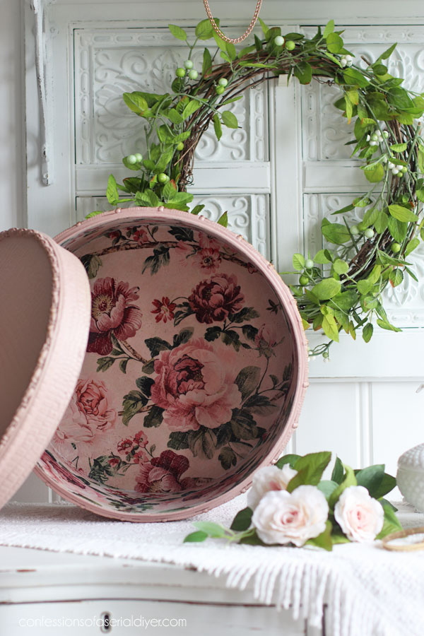 Line the inside of a hatbox with decoupage paper