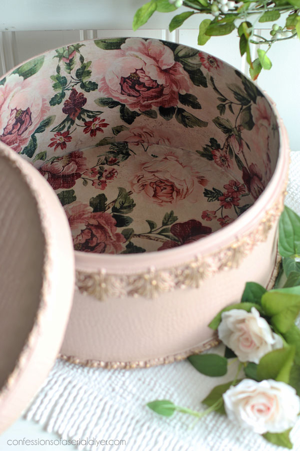 Line the inside of a hatbox with decoupage paper